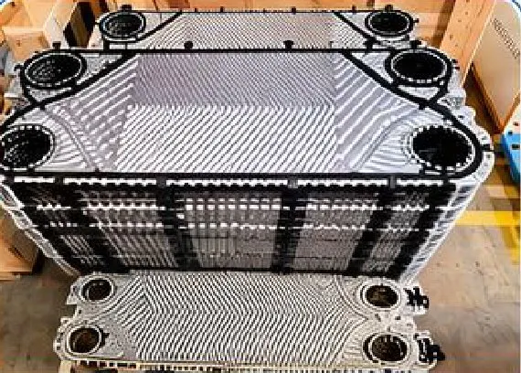 Stack of PHE channel plates fitted with black rubber gaskets